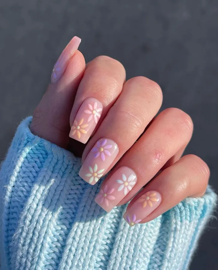 3D colorful flower nail art with bumblebee - creative hand showcasing colorful 3D flower petals with bumblebee accent, featuring green leaves and stems on almond-shaped nails